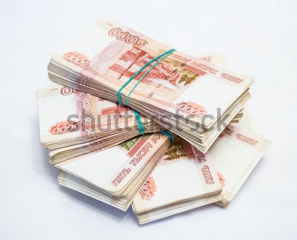 1000000 российских рублей. 5000 Рублей стопка. Пачки денег в руках и на столе.